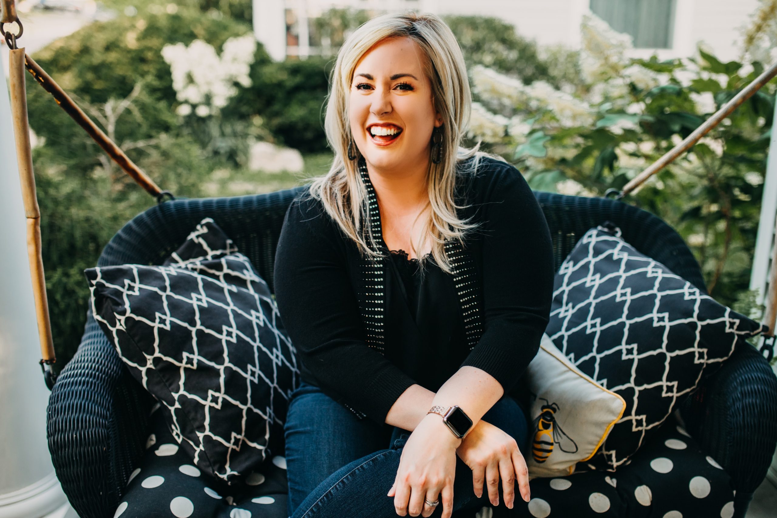 Bethany Jett sitting in porch swing.